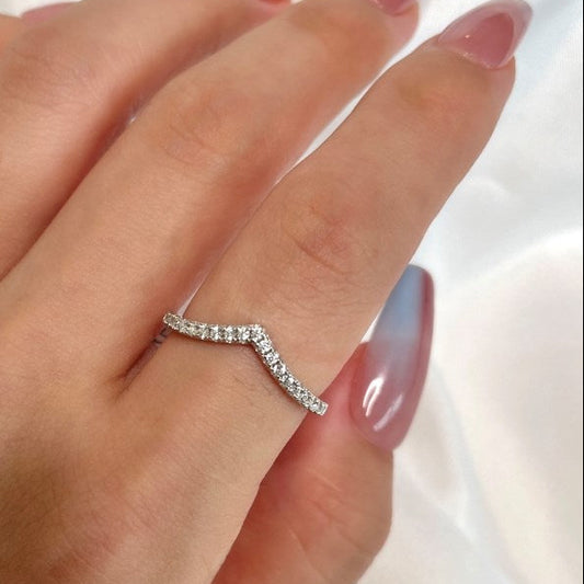 Silver ring on a hand with a white background